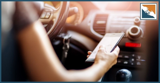 Woman texting while driving